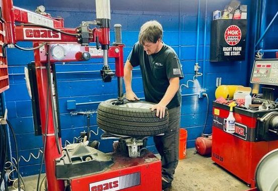 An ABS Unlimited auto technician repairs a tire | tires and tire services
