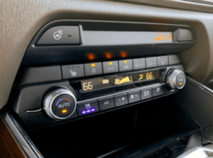 an a/c console inside of a car | ABS Unlimited in Fairfax, VA.